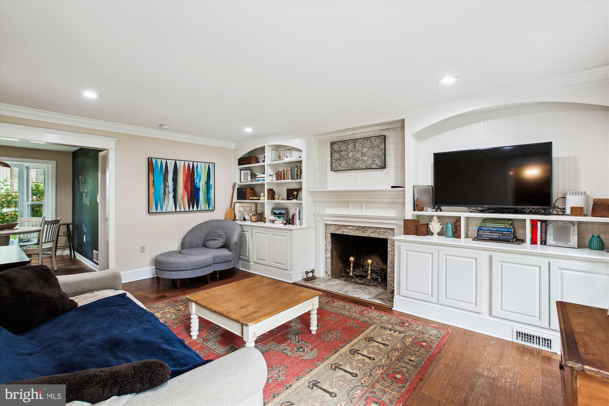 8231 Crown Court Road Alexandria, VA 22308 - Photo 4 of 33 a living room with furniture and a flat screen tv