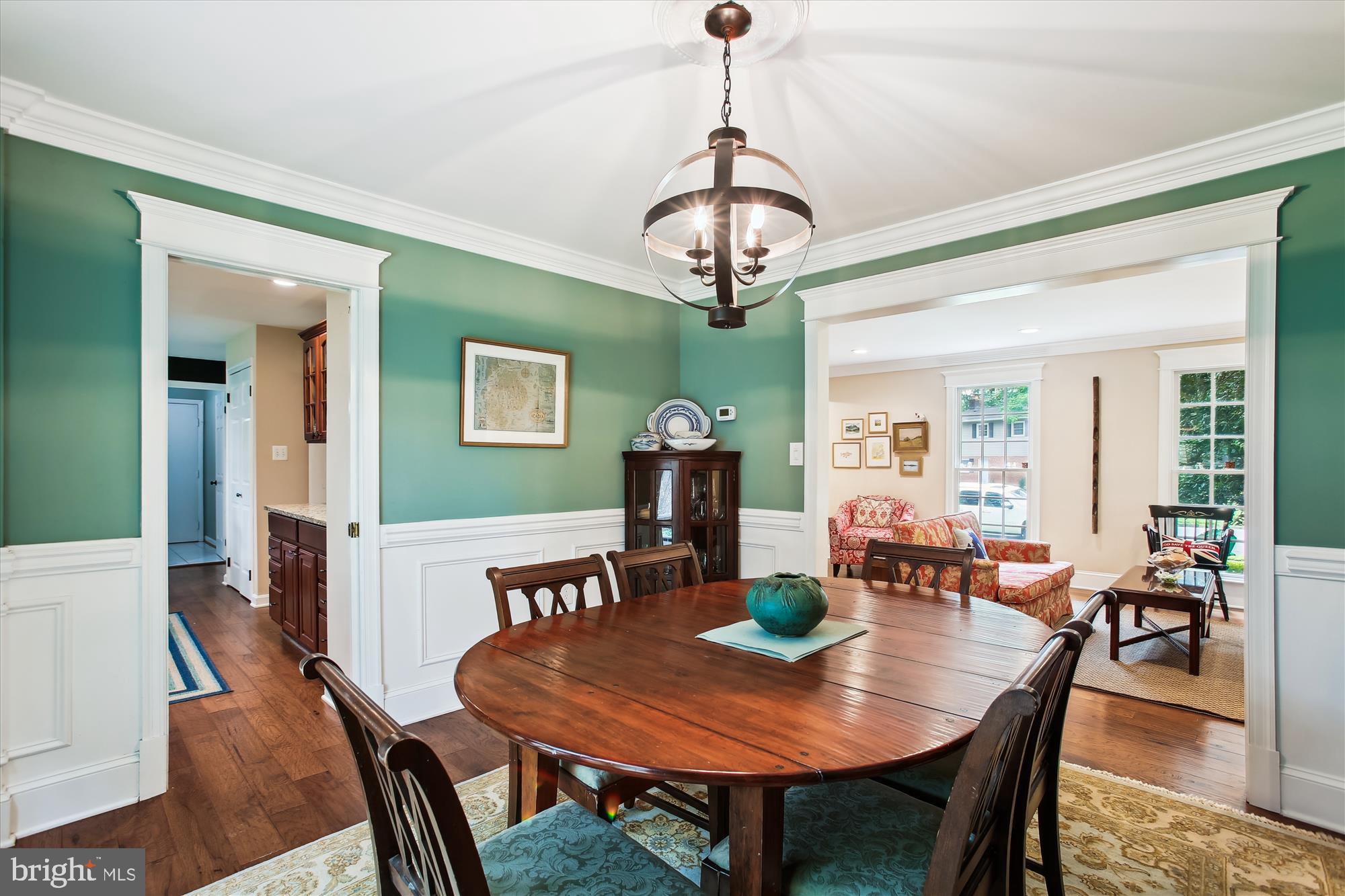 8231 Crown Court Road Alexandria, VA 22308 - Photo 5 of 33 a view of a dining room with furniture wooden floor and chandelier