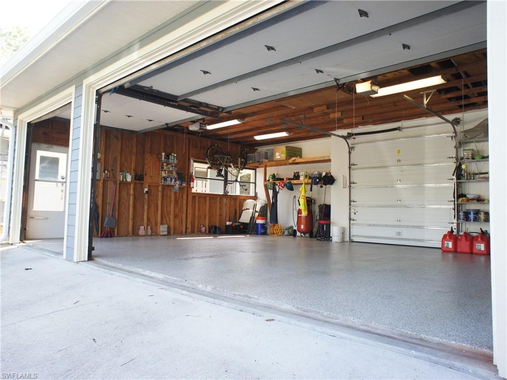 6840 Sable Ridge Lane Naples, FL 34109 - Photo 11 of 38 Garage with wooden walls