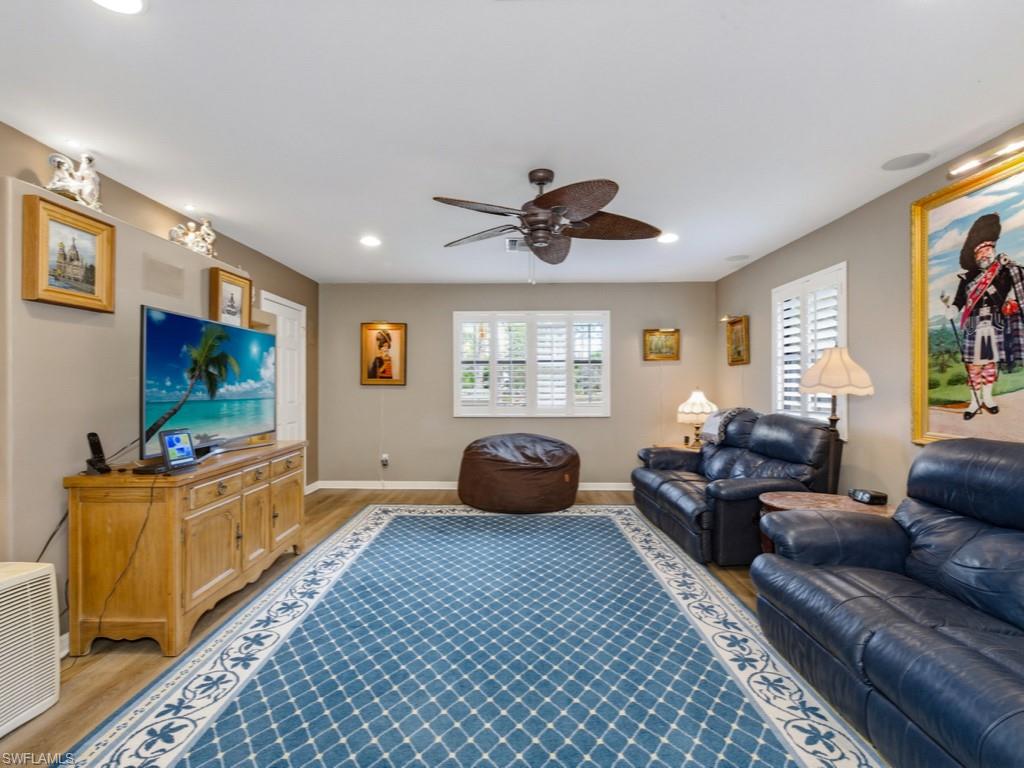 6840 Sable Ridge Lane Naples, FL 34109 - Photo 21 of 38 Bedroom/Media room finished floors, and recessed lighting