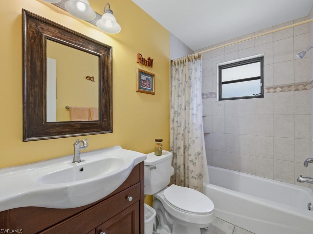 6840 Sable Ridge Lane Naples, FL 34109 - Photo 25 of 38 Bathroom with vanity and shower / tub combo