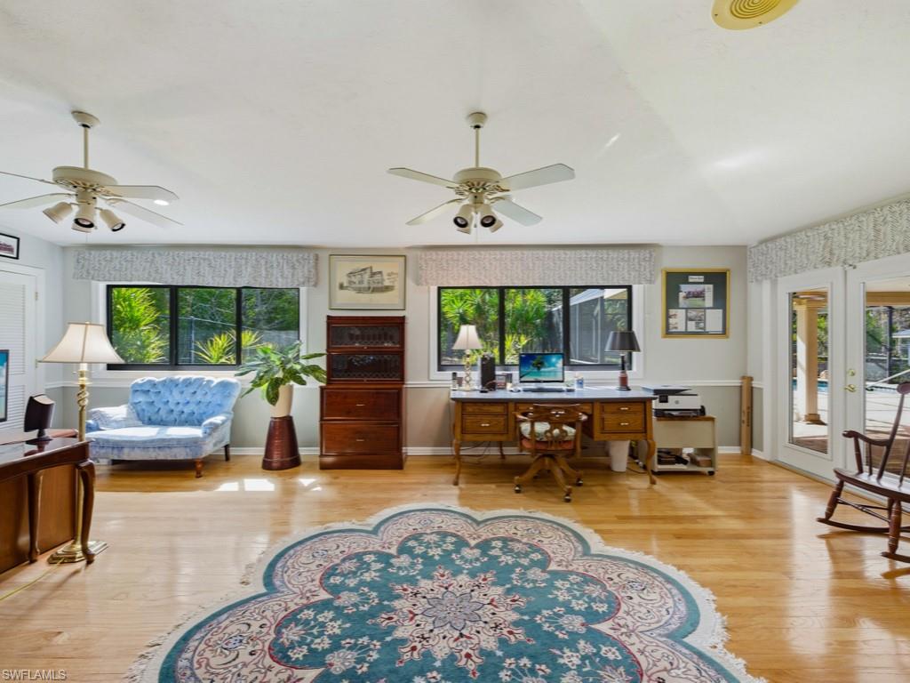 6840 Sable Ridge Lane Naples, FL 34109 - Photo 31 of 38 Bedroom featuring ceiling fan, light wood-type flooring, and an office area