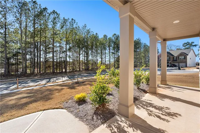 a view of a swimming pool with an outdoor space and seating area