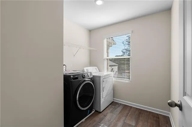 a front view of a house with a yard covered in snow