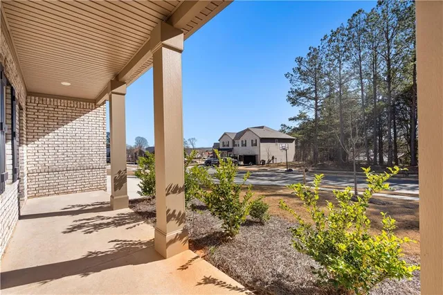 a view of a house with swimming pool and sitting area