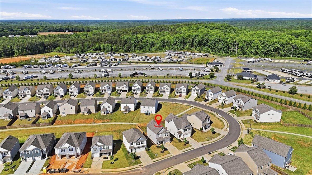 403 Seaborn Circle Pendleton, SC 29670 - Photo 41 of 47 An aerial perspective reveals a new residential neighborhood bordered by a vast RV storage facility and lush woodlands.