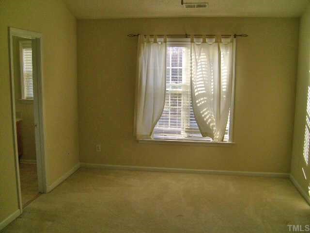 2352 Persimmon Ridge Drive Raleigh, NC 27604 - Photo 9 of 12 a view of a room that has a window in it