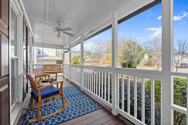 a view of a balcony with furniture