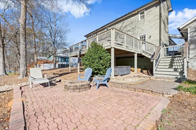 a view of a building with backyard and trees