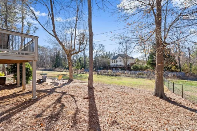 a view of a house with a yard covered with snow in the background