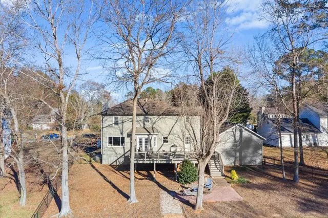a view of house with a yard