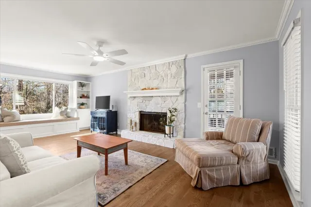 a living room with furniture and a fireplace