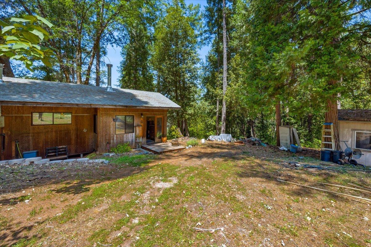 19643 Sages Road Nevada City, CA 95959 - Photo 38 of 39 a view of a house with backyard and sitting area