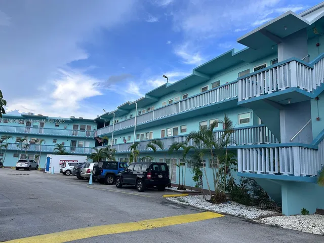 a view of parking car parked in front of building