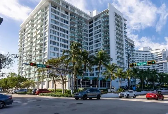 a city street lined with buildings and cars