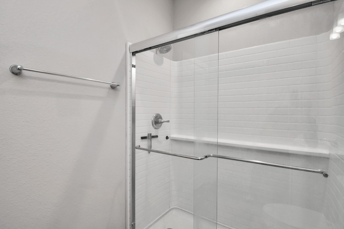 23823 Cumberland Ridge Drive, Unit 515 Hockley, TX 77447 - Photo 13 of 29 a bathroom with a shower