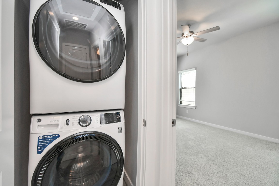 23823 Cumberland Ridge Drive, Unit 515 Hockley, TX 77447 - Photo 14 of 29 a view of a livingroom with washer and dryer