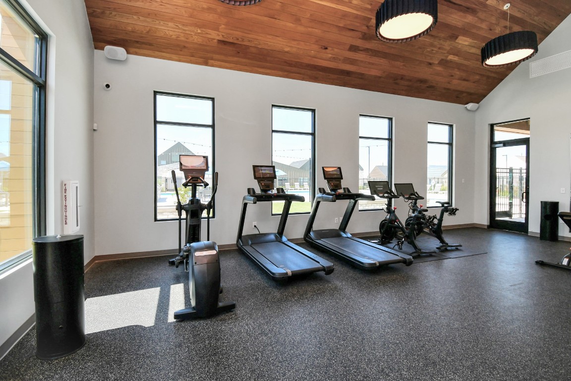 23823 Cumberland Ridge Drive, Unit 515 Hockley, TX 77447 - Photo 27 of 29 a view of a room with gym equipment