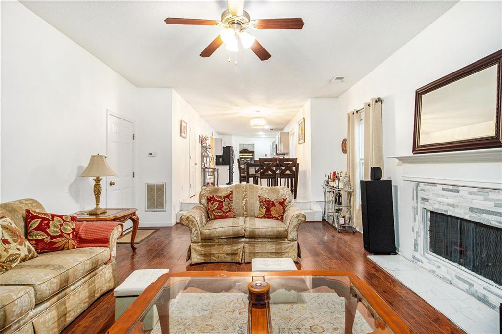 5139 Miller Woods Trail Decatur, GA 30035 - Photo 11 of 36 a living room with furniture and a fireplace