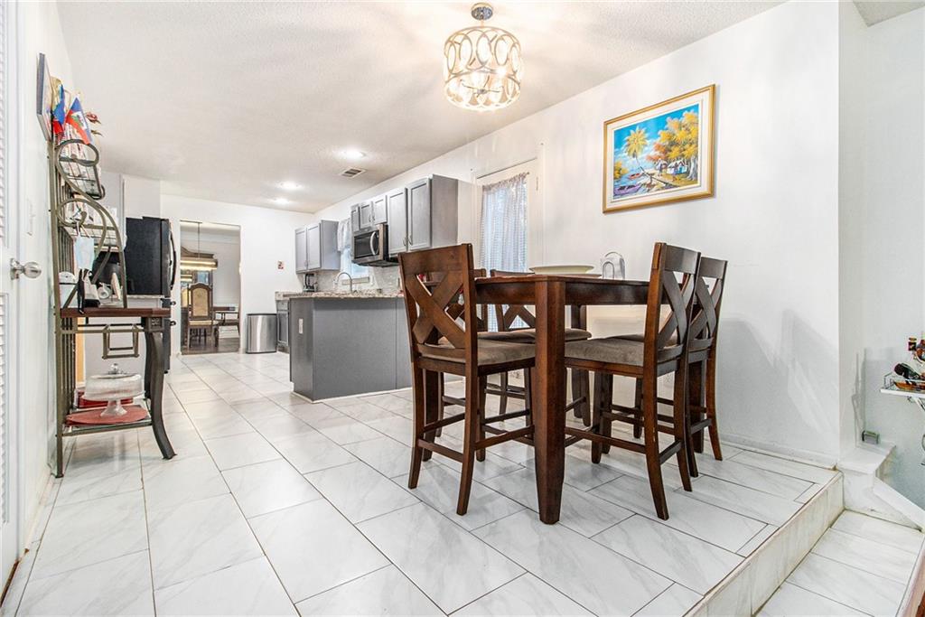 5139 Miller Woods Trail Decatur, GA 30035 - Photo 14 of 36 a view of a dining room with furniture