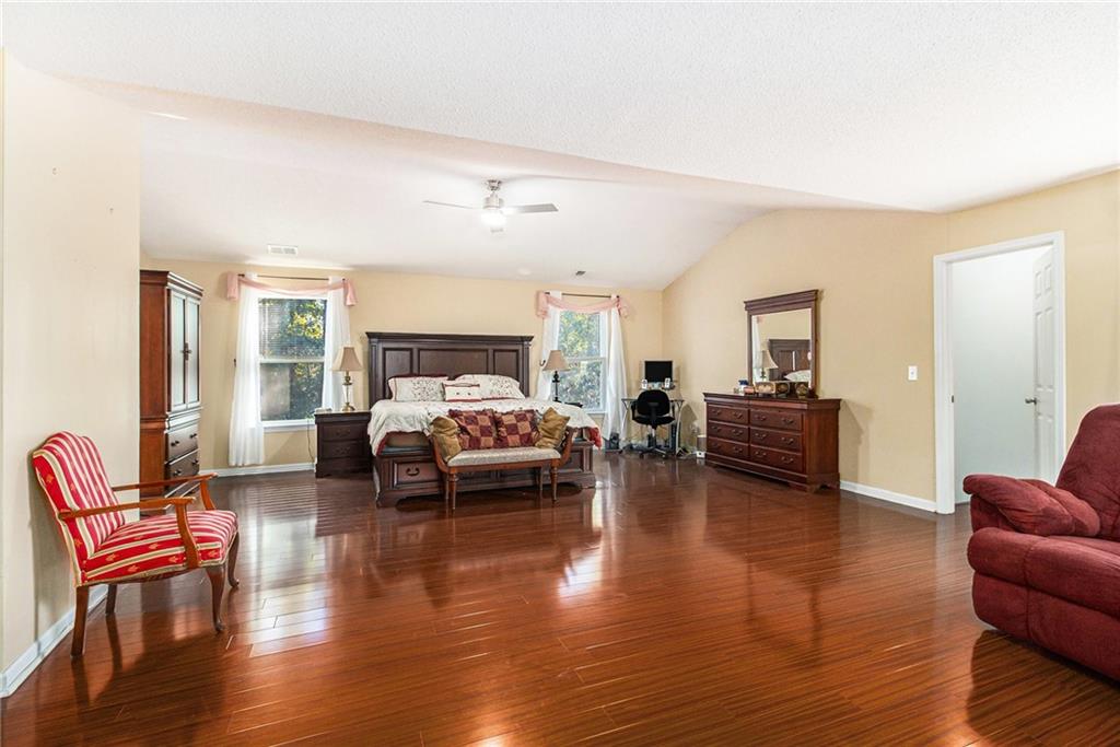 5139 Miller Woods Trail Decatur, GA 30035 - Photo 21 of 36 a living room with furniture and a wooden floor