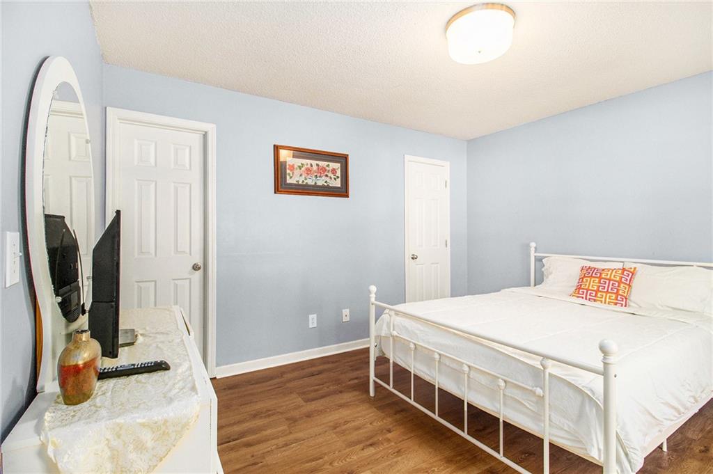 5139 Miller Woods Trail Decatur, GA 30035 - Photo 29 of 36 a bedroom with a bed and a flat screen tv