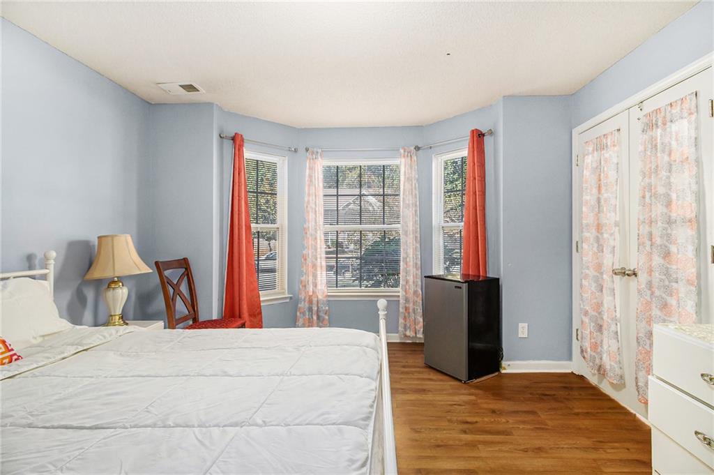 5139 Miller Woods Trail Decatur, GA 30035 - Photo 30 of 36 a bedroom with a large bed and a large window