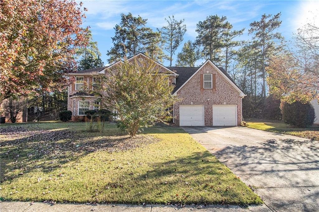 5139 Miller Woods Trail Decatur, GA 30035 - Photo 3 of 36 a front view of a house with a yard covered with snow