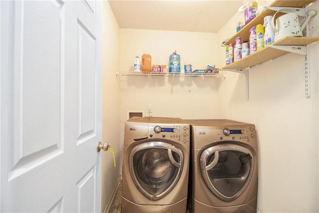 5139 Miller Woods Trail Decatur, GA 30035 - Photo 32 of 36 a utility room with dryer and washer
