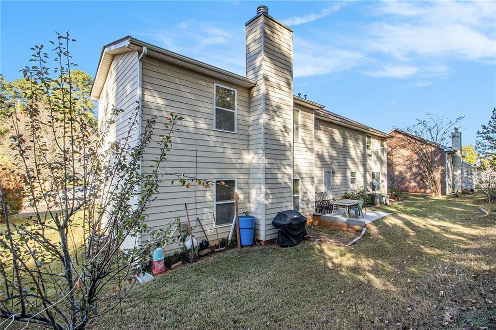 5139 Miller Woods Trail Decatur, GA 30035 - Photo 34 of 36 a view of a house with a yard