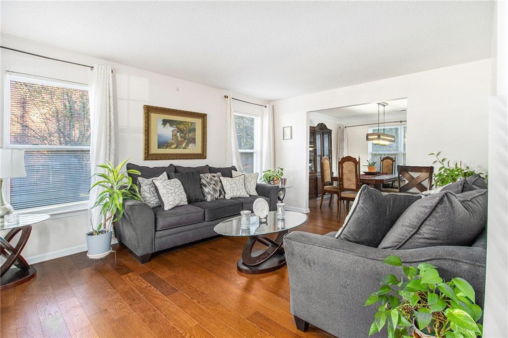5139 Miller Woods Trail Decatur, GA 30035 - Photo 8 of 36 a living room with furniture and a wooden floor