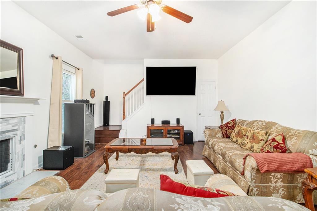 5139 Miller Woods Trail Decatur, GA 30035 - Photo 9 of 36 a living room with furniture and a flat screen tv