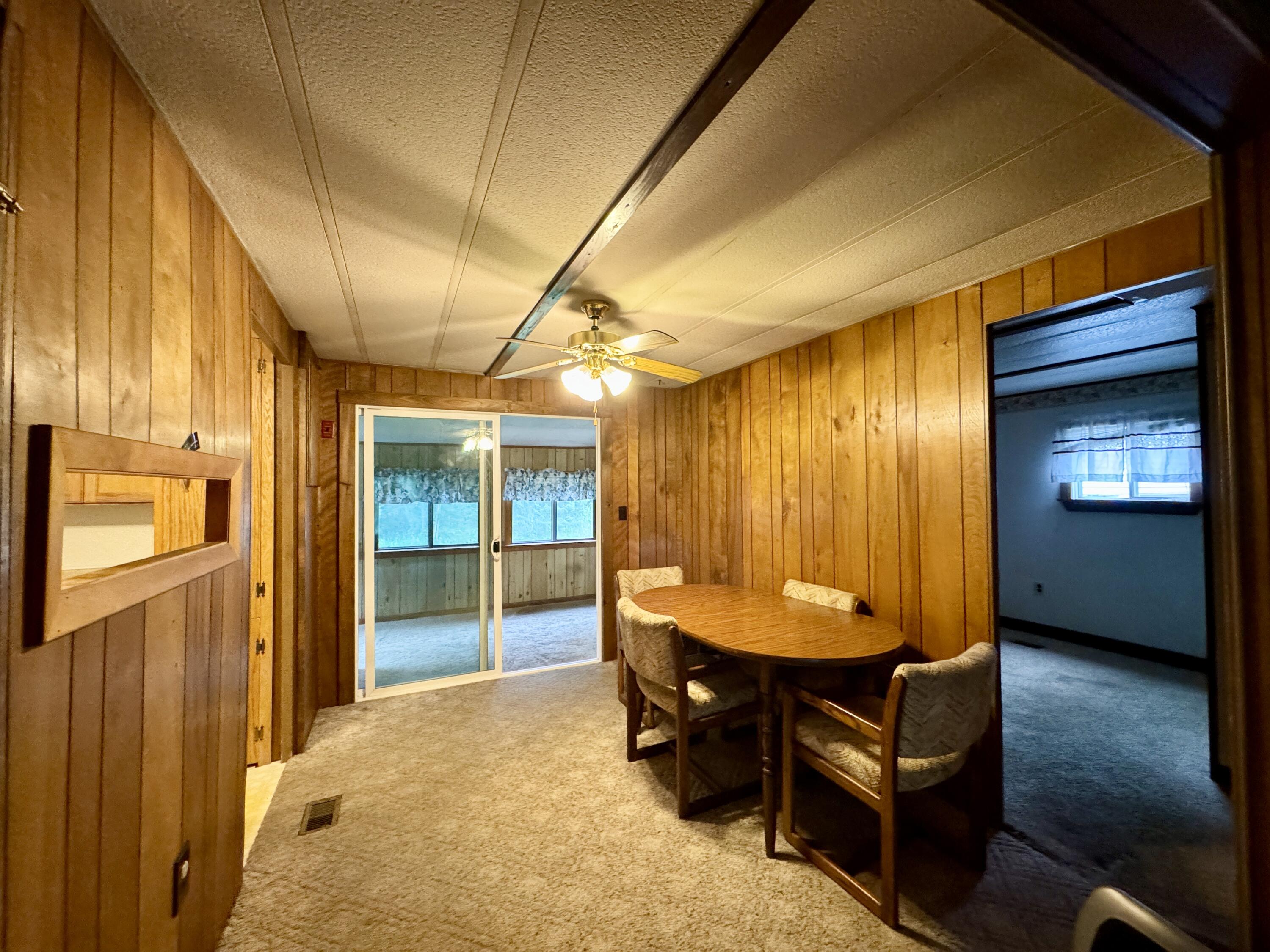 548 Main Road Charleston, ME 04422 - Photo 7 of 43 Dining Room to Sun Room and Bedroom