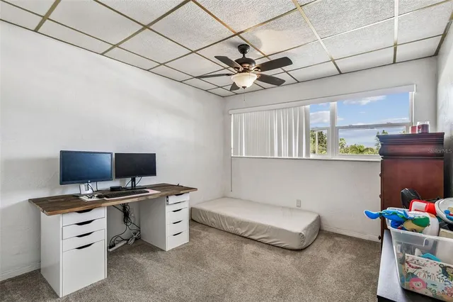 a bathroom with a granite countertop sink a toilet and bathtub