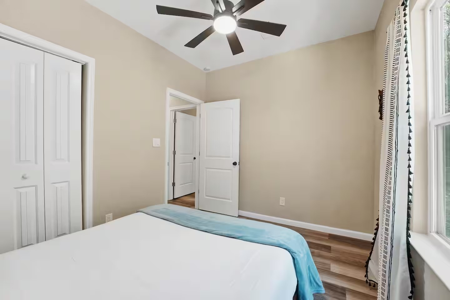 201 Winfield Thicket Road Bastrop, TX 78602 - Photo 25 of 36 a bedroom with a bed and a ceiling fan