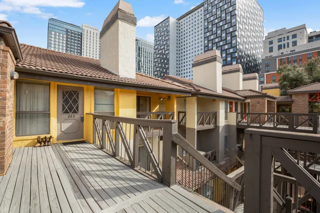 a view of a brick building from a balcony