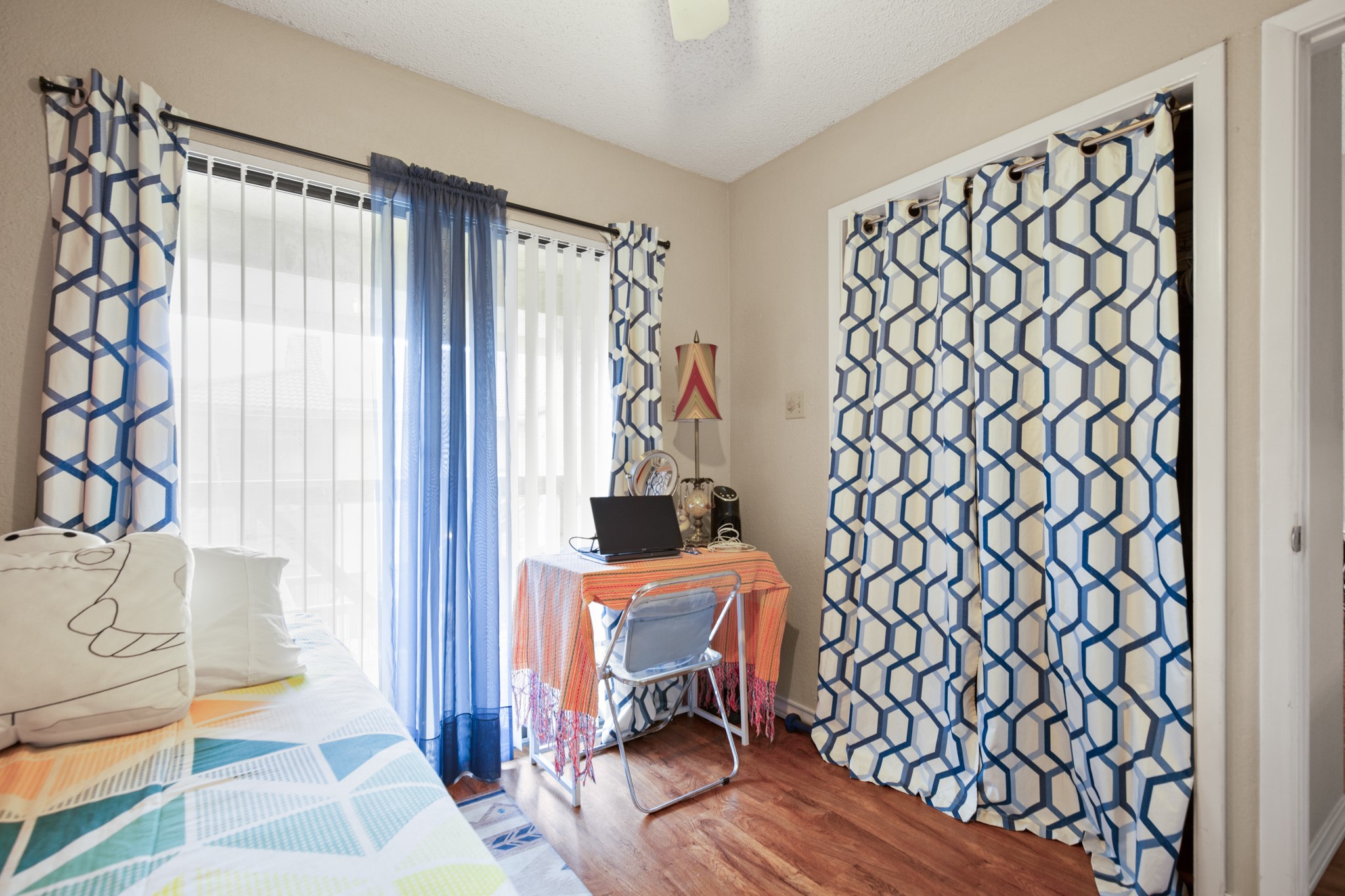 806 West 24th Street, Unit 323 Austin, TX 78705 - Photo 7 of 16 a view of a bedroom with furniture and a window