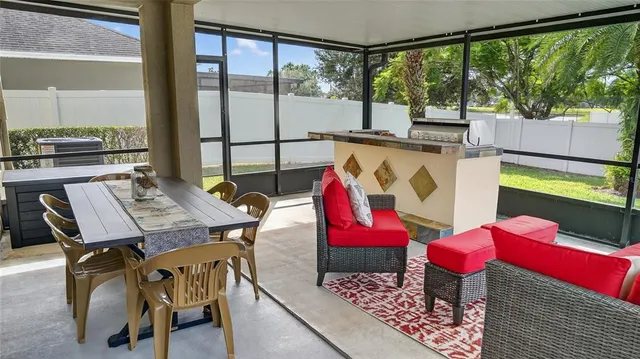 a view of a dining room with furniture window and outside view