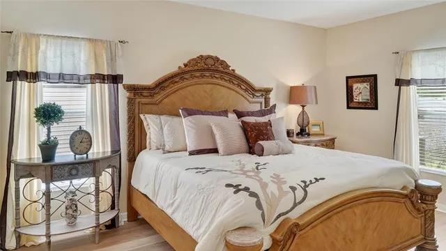 a bedroom with a bed and window