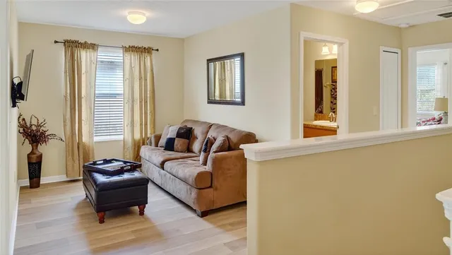 a living room with furniture and a window