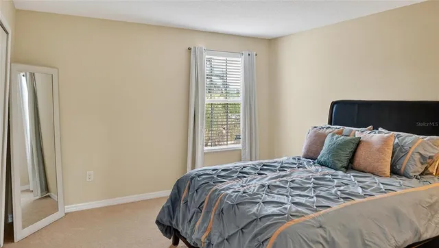 a view of a swimming pool with a table and chairs