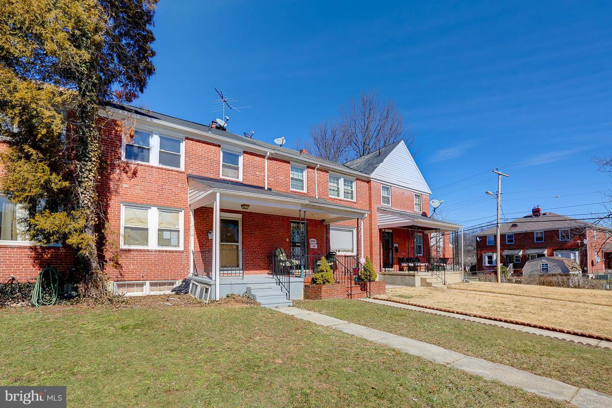1434 Stonewood Road Baltimore, MD 21239 - Photo 2 of 28 a view of a building with a patio