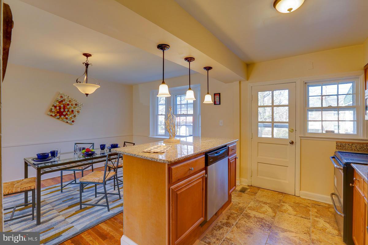 1434 Stonewood Road Baltimore, MD 21239 - Photo 17 of 28 a kitchen that has a lot of cabinets in it