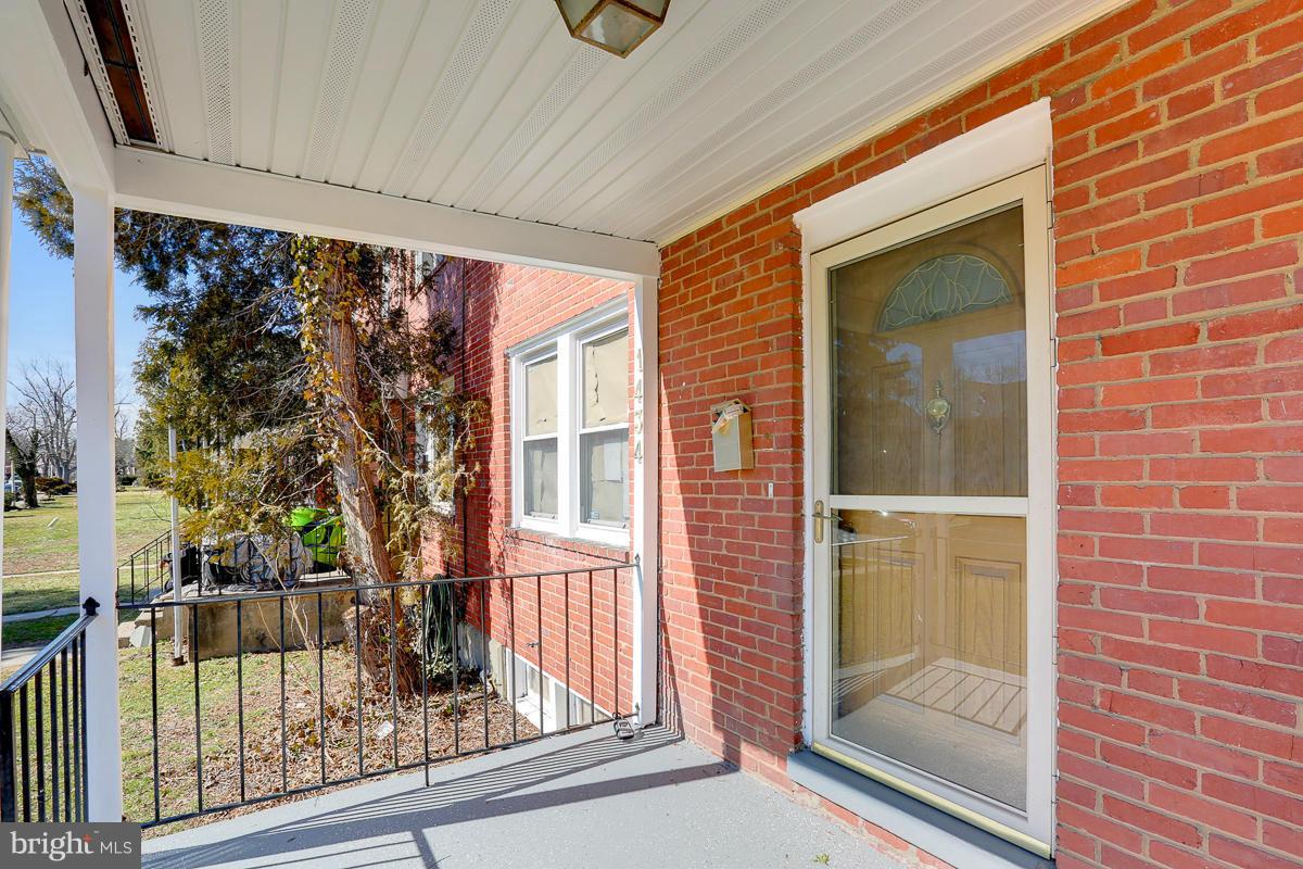 1434 Stonewood Road Baltimore, MD 21239 - Photo 3 of 28 a view of a door and a window