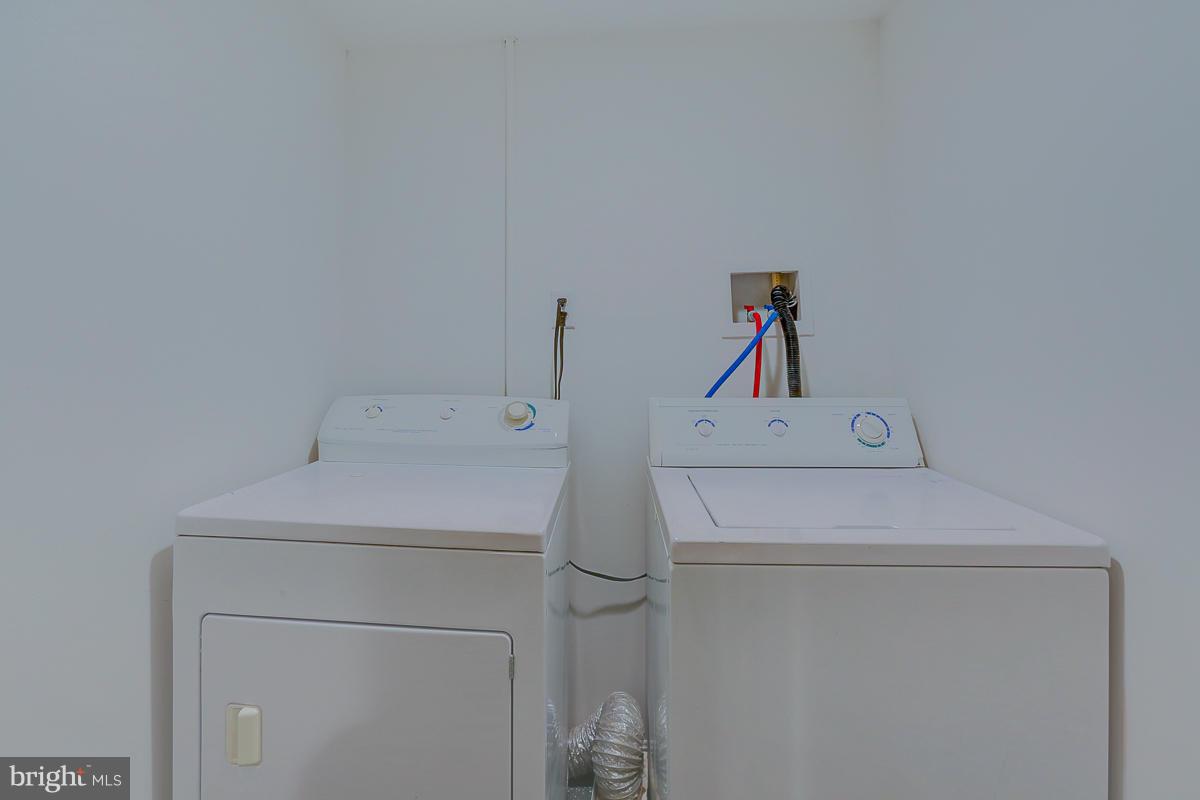 1434 Stonewood Road Baltimore, MD 21239 - Photo 21 of 28 a utility room with dryer and washer
