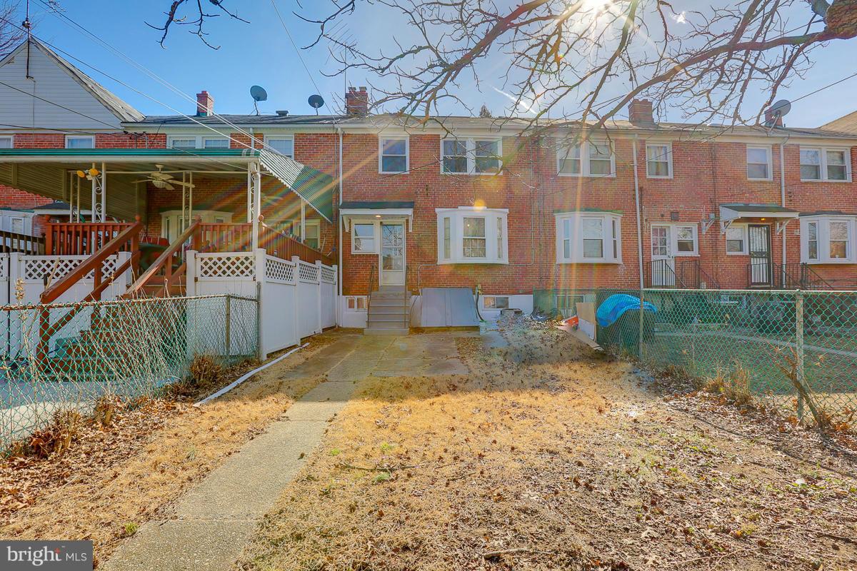 1434 Stonewood Road Baltimore, MD 21239 - Photo 28 of 28 a view of a house with a yard