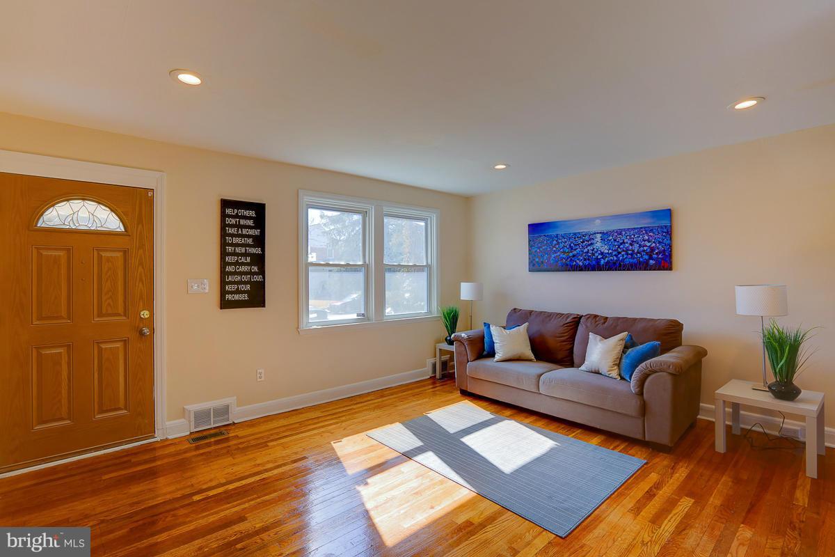 1434 Stonewood Road Baltimore, MD 21239 - Photo 5 of 28 a living room with furniture and wooden floor