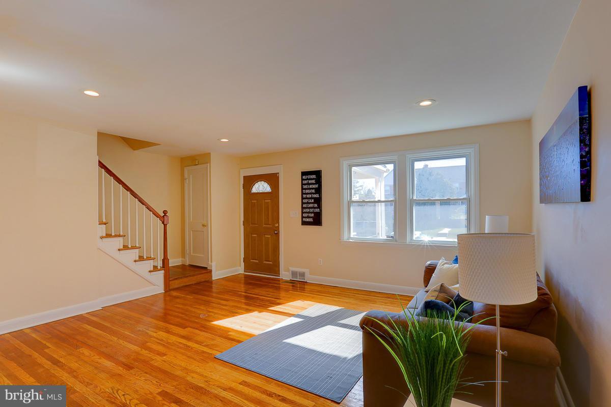 1434 Stonewood Road Baltimore, MD 21239 - Photo 6 of 28 a living room with furniture and a window