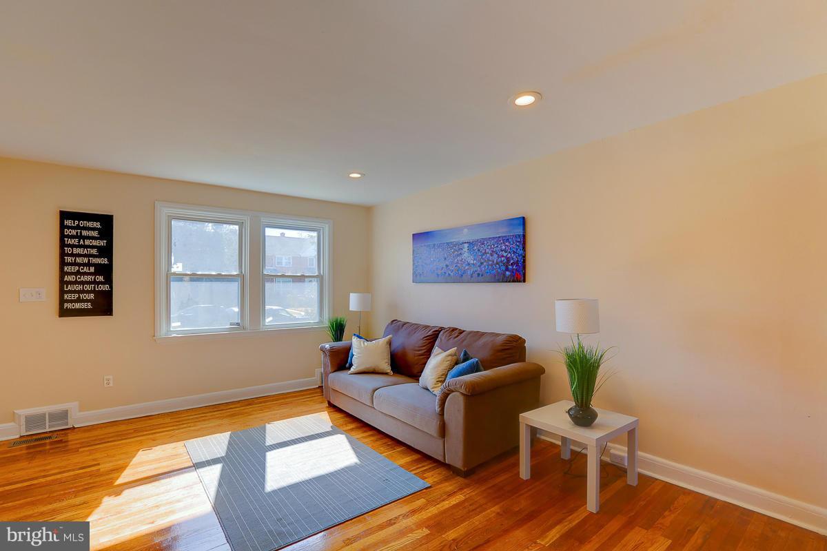1434 Stonewood Road Baltimore, MD 21239 - Photo 7 of 28 a living room with furniture and a window