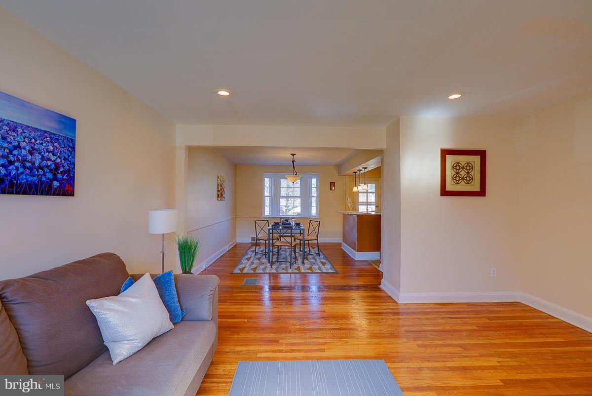 1434 Stonewood Road Baltimore, MD 21239 - Photo 8 of 28 a living room with furniture and wooden floor